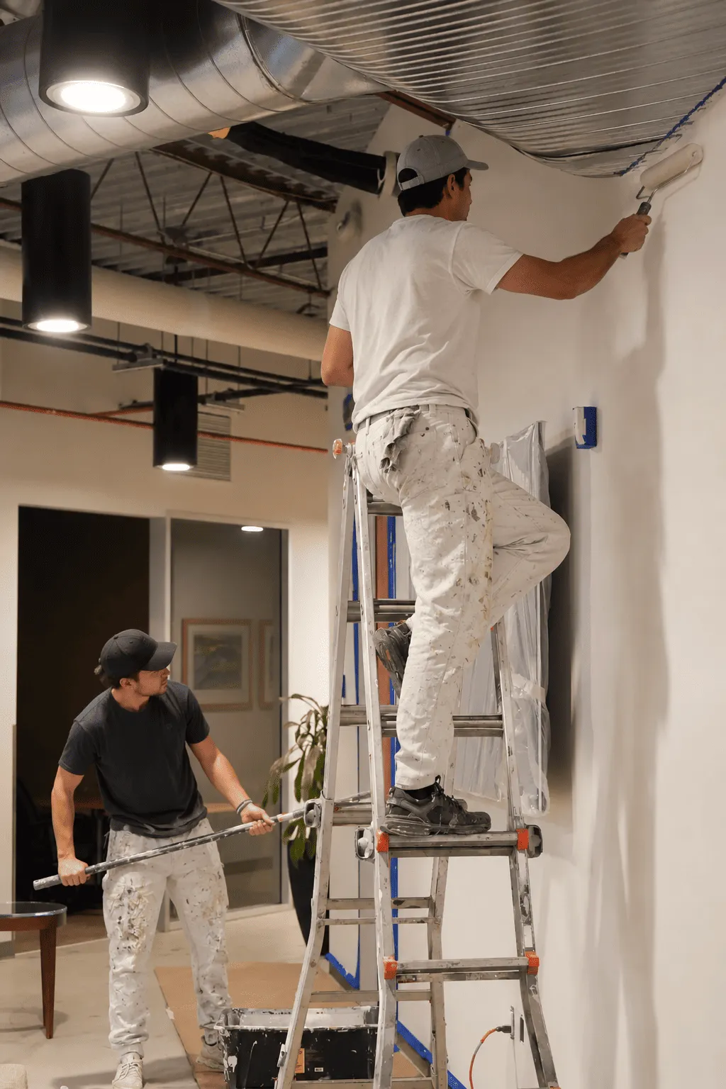 Painting team carrying out commercial finishing work