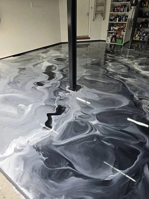 Decorative metallic epoxy floor showing marbled pigment patterns
