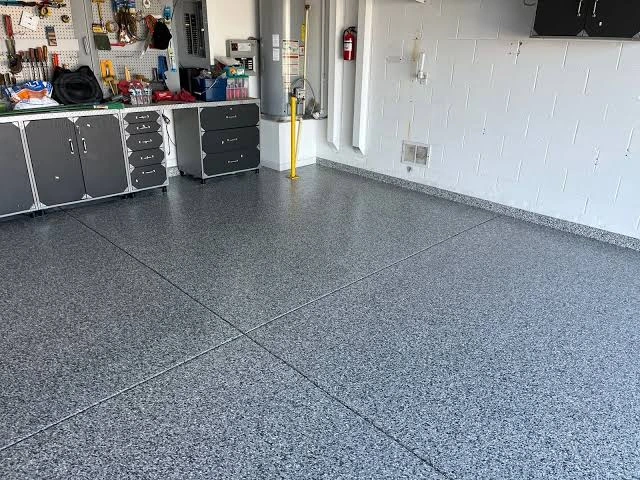 Finished concrete floor with a polyaspartic coating